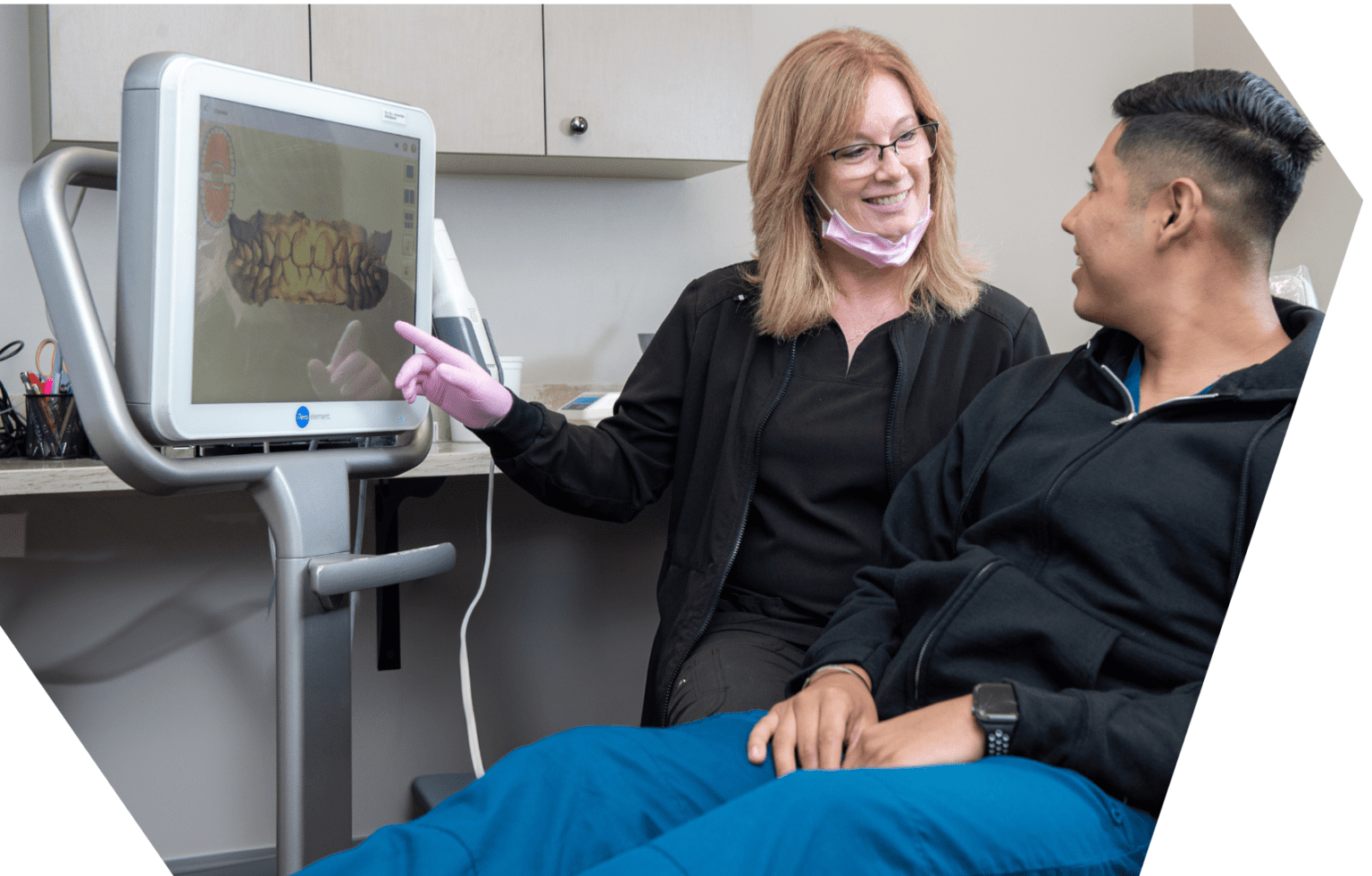 A Werner Orthodontics team member showing a patient a digital scan of his teeth