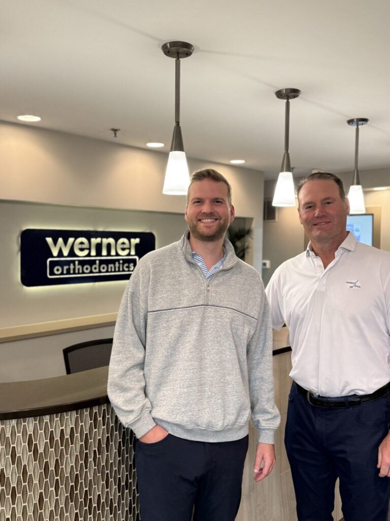 Dr. Michael Myers and Dr. Greg Werner at the Werner Orthodontics front desk